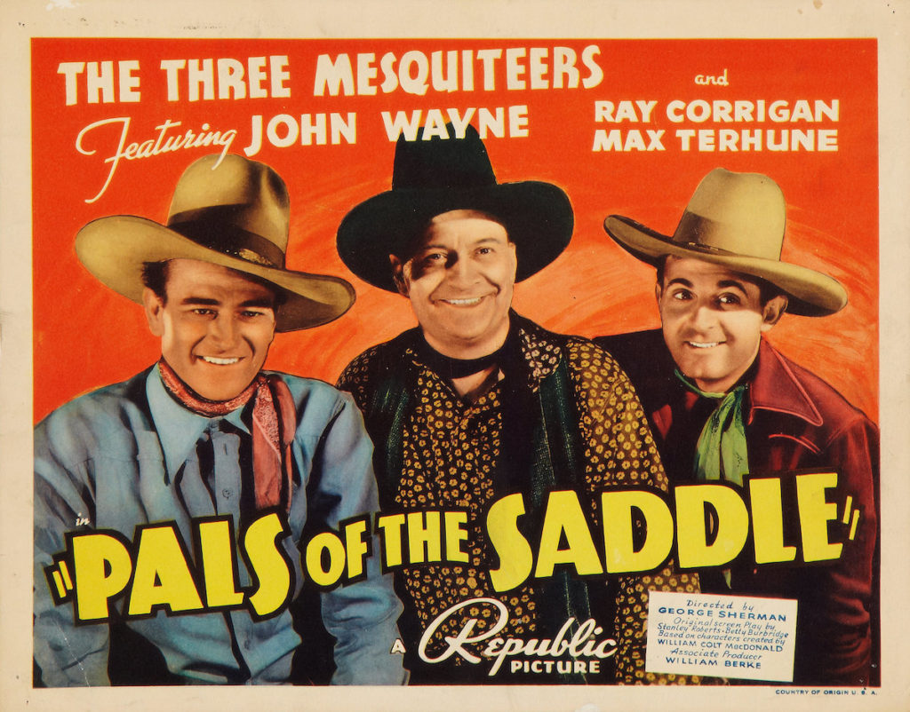 John Wayne in Pals of the Saddle lobby card