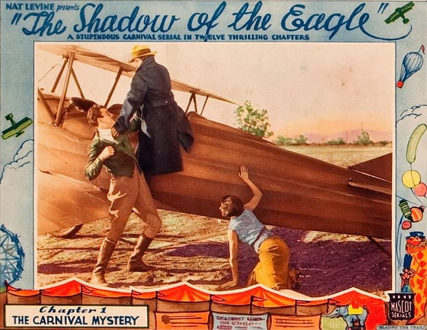 Lobby card for Shadow of the Eagle starring John Wayne